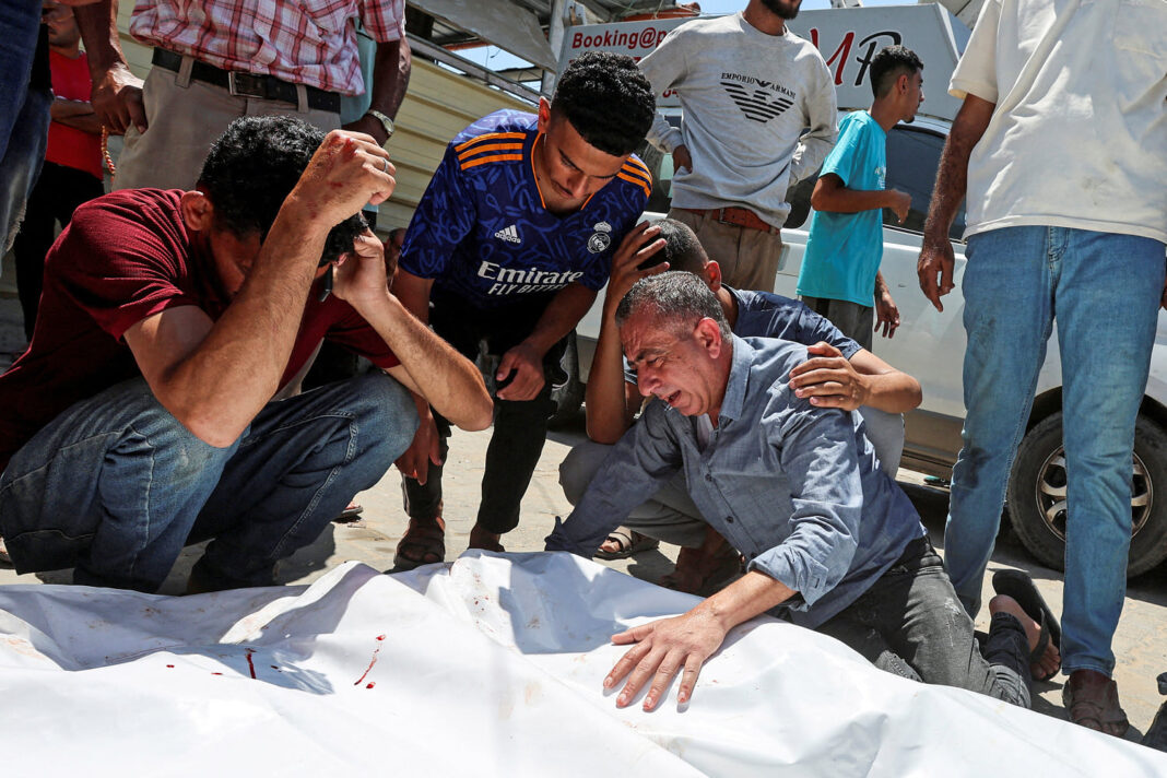 An Israeli strike kills 18 Palestinians in central Gaza as turmoil mounts over food distribution