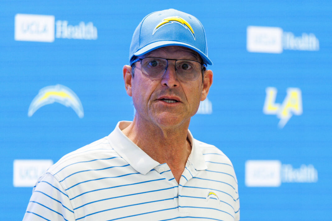 Former University of Michigan coach Jim Harbaugh named in class action suit against Matt Weiss
